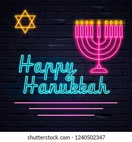 Illuminated neon signs Happy Hanukkah  holiday light electric banner glowing on black brickwall. Neons sign billboard design template with traditional Jewish candles, Menorah, Magen David Star