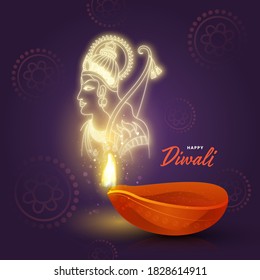 Illuminated Oil Lamp (Diya) with Shiny Lord Rama on Purple Floral Pattern Background for Happy Diwali Celebration.