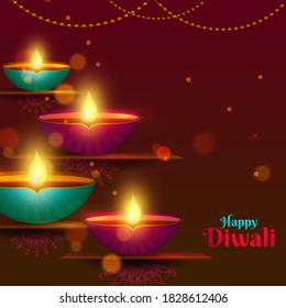 Illuminated Oil Lamps (Diya) with Bokeh Effect and Lighting Garland Decorated on Brown and Red Background for Happy Diwali Celebration.