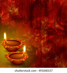 Illuminated Oil Lamps (Diya) on abstract background for Indian Festival of Lights, Happy Diwali celebration.