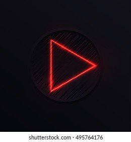 Illuminated play button on dark background
