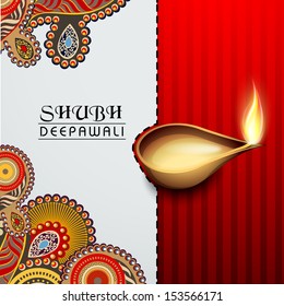 Illuminated traditional colorful oil lit lamp on floral decorated background for Happy Diwali festival celebration in India. 