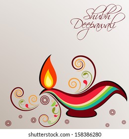 Illuminated traditional colorful oil lit lamp on floral decorated background for Indian festival of lights, Shubh Deepawali (Happy Deepawali).