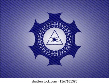 illuminati pyramid icon inside badge with denim background