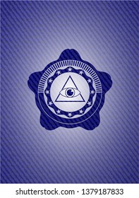 illuminati pyramid icon inside badge with denim texture