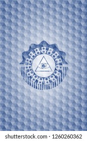 illuminati pyramid icon inside blue emblem with geometric pattern background.