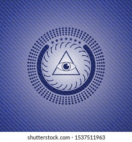 illuminati pyramid icon inside denim background