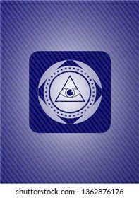illuminati pyramid icon inside emblem with denim high quality background