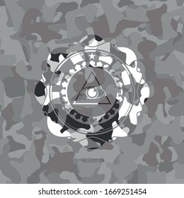 illuminati pyramid icon inside grey camouflaged emblem