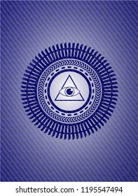illuminati pyramid icon inside jean or denim emblem or badge background