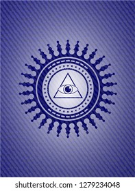 illuminati pyramid icon inside jean or denim emblem or badge background