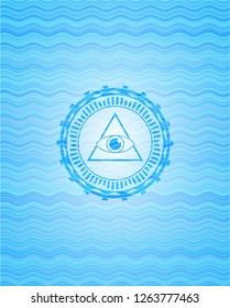 illuminati pyramid icon inside sky blue water emblem.