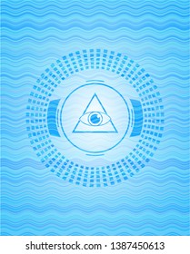 illuminati pyramid icon inside sky blue water wave badge background.