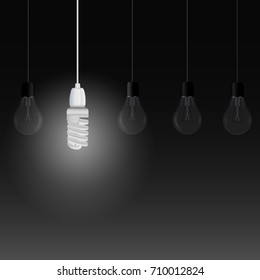 Illuminating energy saving lamp among other light bulbs on a dark background. Vector illustration for your design