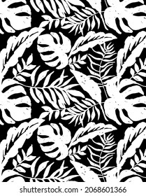 illustrated vector monochrome tropical pattern depicting white Palm, Banana, Monstera leaves  on a black background