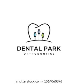 Illustration of abstract tooth dental mark with a view of trees inside logo design.