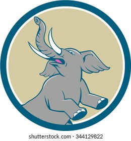 Illustration of an african elephant prancing looking up to the side set inside circle on isolated background done in cartoon style. 