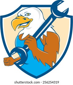 Illustration of a american bald eagle mechanic smiling holding wrench on shoulder viewed from side set inside shield crest done in cartoon style. 