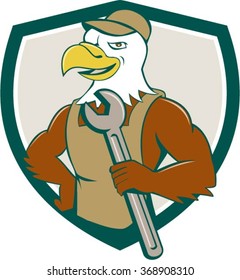 Illustration of a american bald eagle mechanic holding spanner looking to the side with one hand on hips set inside shield crest done in cartoon style. 