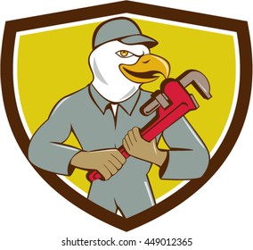 Illustration of an american bald eagle plumber holding monkey wrench looking to the side set inside shield crest done in cartoon style. 