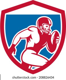Illustration of an american football gridiron player running with ball facing side set inside shield crest on isolated background done in retro style.