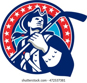 Illustration of an american patriot holding ice hockey stick looking to the side viewed from front set inside circle with stars in the background done in retro style. 