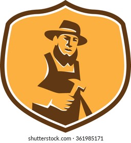 Illustration of an amish carpenter builder wearing hat holding hammer faciing front set inside shield crest on isolated background done in retro style.  svg