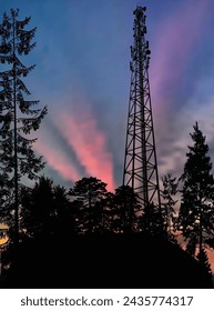 illustration with antenna tower silhouette in black forest at pink sky background