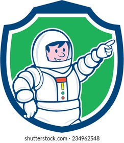 Illustration of an astronaut pointing facing front set inside shield crest on isolated background done in cartoon style