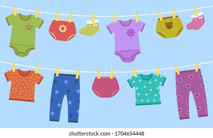 Illustration of baby clothes on clothespins. Set of overalls, shirts, underpants, socks, pants for girls and boys.