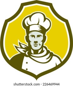 Illustration of a baker chef cook bust with hat facing front set inside shield crest on isolated background done in retro style. 