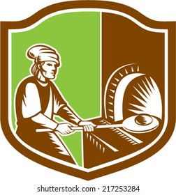 Illustration of a baker pizza maker holding peel pan with bread dough putting in open fire woodfire oven set inside shield crest done in retro style. 