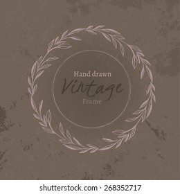 The illustration of  beautiful hand drawn vintage frame on an aged texture. Vector image. Classical and abstract ornaments