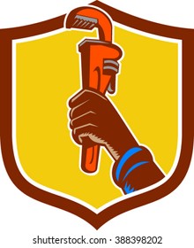 Illustration of a black plumber hand raising monkey adjustable wrench viewed from the side set inside shield crest done in retro style. 