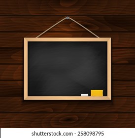 Illustration of blank black chalkboard with chalk and eraser on wood background 