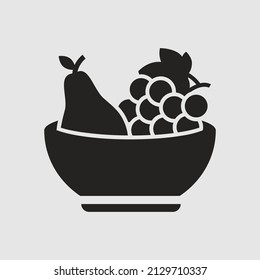 ilustración de un bol de fruta con uvas. icono sólido
