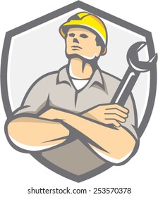 Illustration of a builder construction worker arms crossed holding wrench looking up set inside shield crest on isolated background done in retro style.
