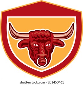 Illustration of a bull head in front view set inside crest shield done on isolated background in retro style.