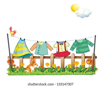 Illustration of a bunny below the hanging clothes on a white background
