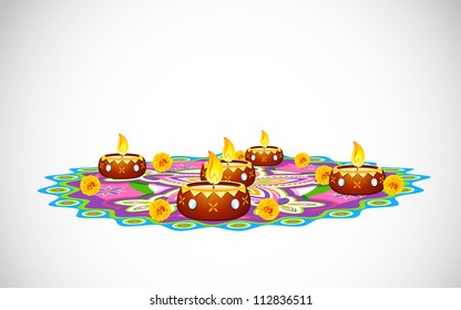 illustration of burning decorated diya on colorful rangoli