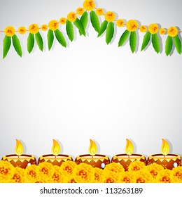 illustration of burning decorated diya on colorful rangoli