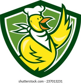 Illustration of a chicken chef cook standing waving hello with bandana on neck and facing side set inside shield crest done in cartoon style.