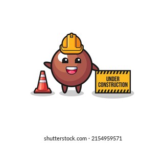 illustration of chocolate ball with under construction banner , cute design