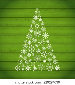 Illustration Christmas pine made of snowflakes on wooden background - vector