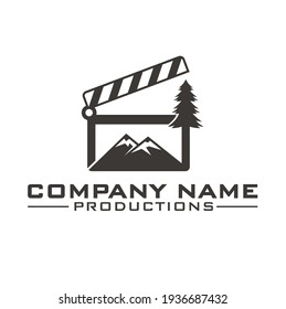 illustration of clapper board, pine and mountain.