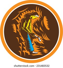 Illustration of a coal miner holding sledgehammer working viewed from the side set inside circle done in retro woodcut style.