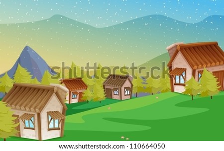 Mountain huts on green meadows in the Alps