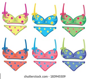 Illustration of the colorful dotted bikinis on a white background