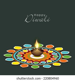 Illustration of colourful rangoli with illuminated brown lit lamp in center and stylish text.