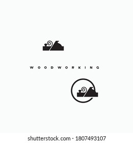
an illustration consisting of an image of a planer plowing a tree and the inscription "woodworking"